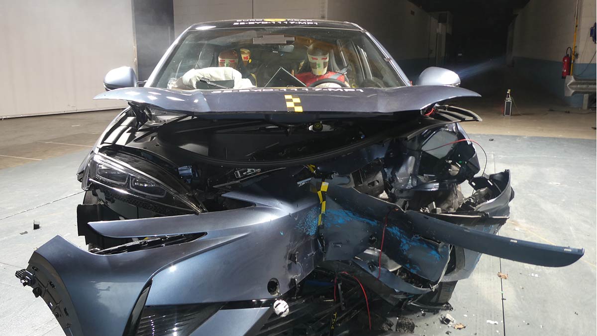 Blue BYD Sealion 7 SUV with heavily damaged front end after Euro NCAP frontal offset crash test.