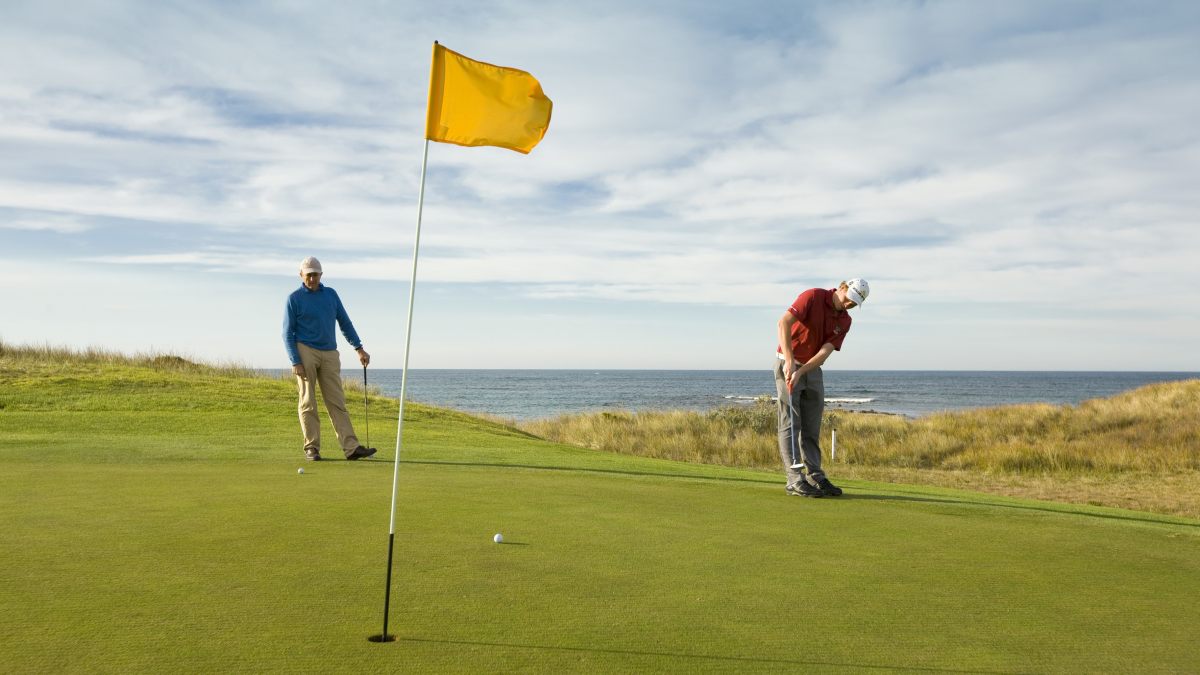 Two people putting a ball at Port Fairy Golf Links