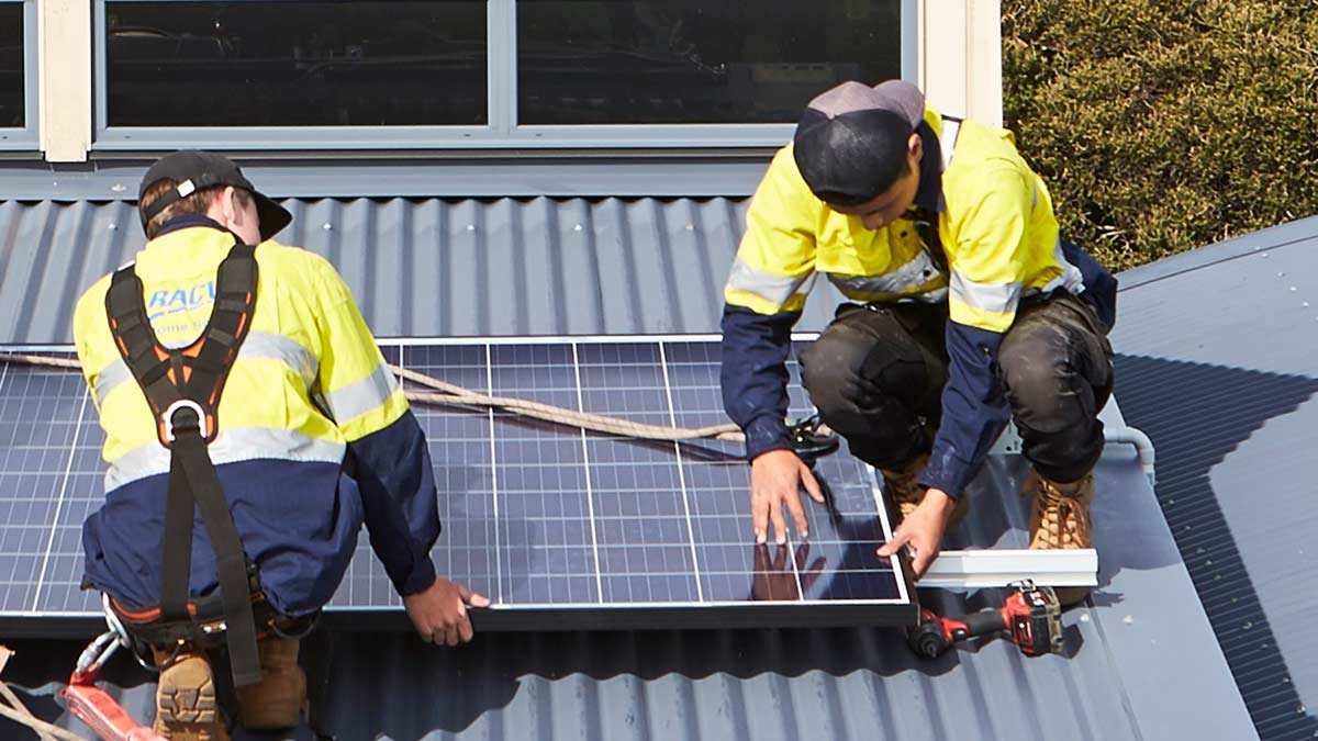RACV Solar technician installing a solar panel