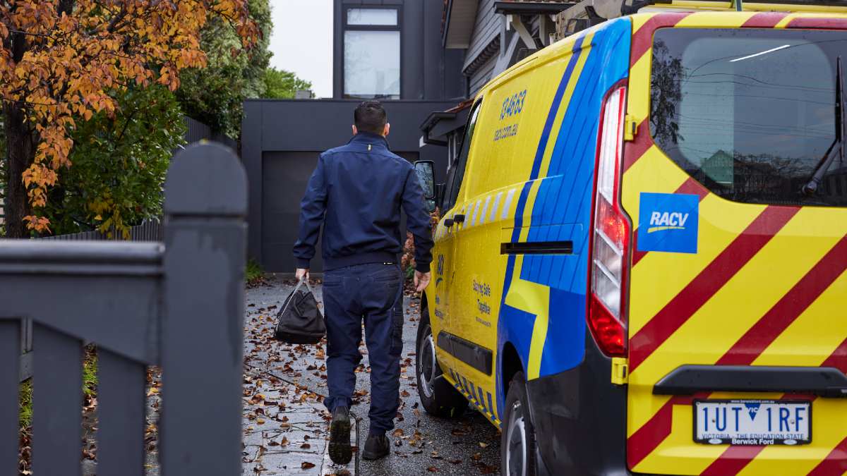 RACV plumber approaching home from EHA van