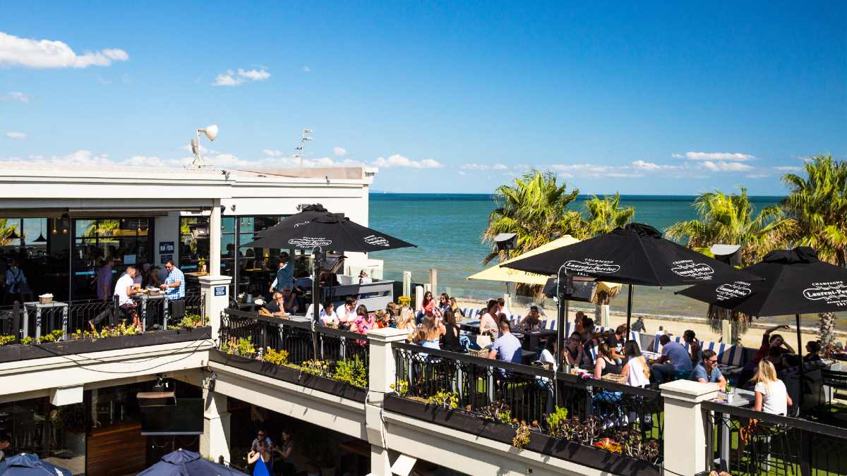rooftop beachside restaurant crowded with diners