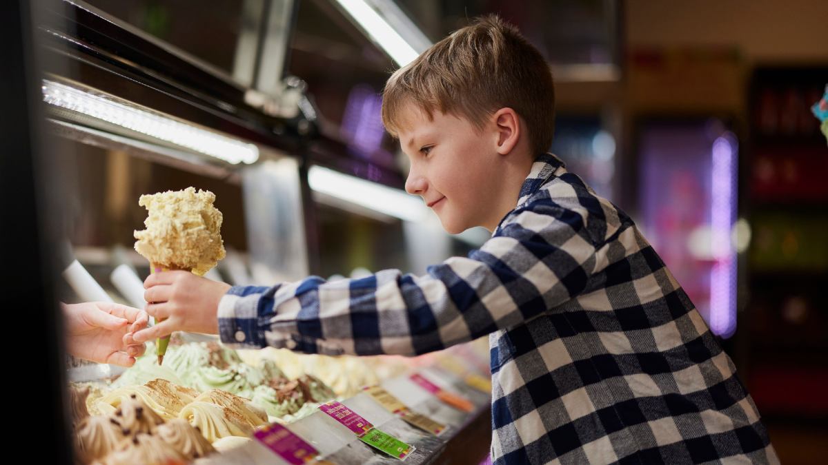 young boy accepting an ice cream