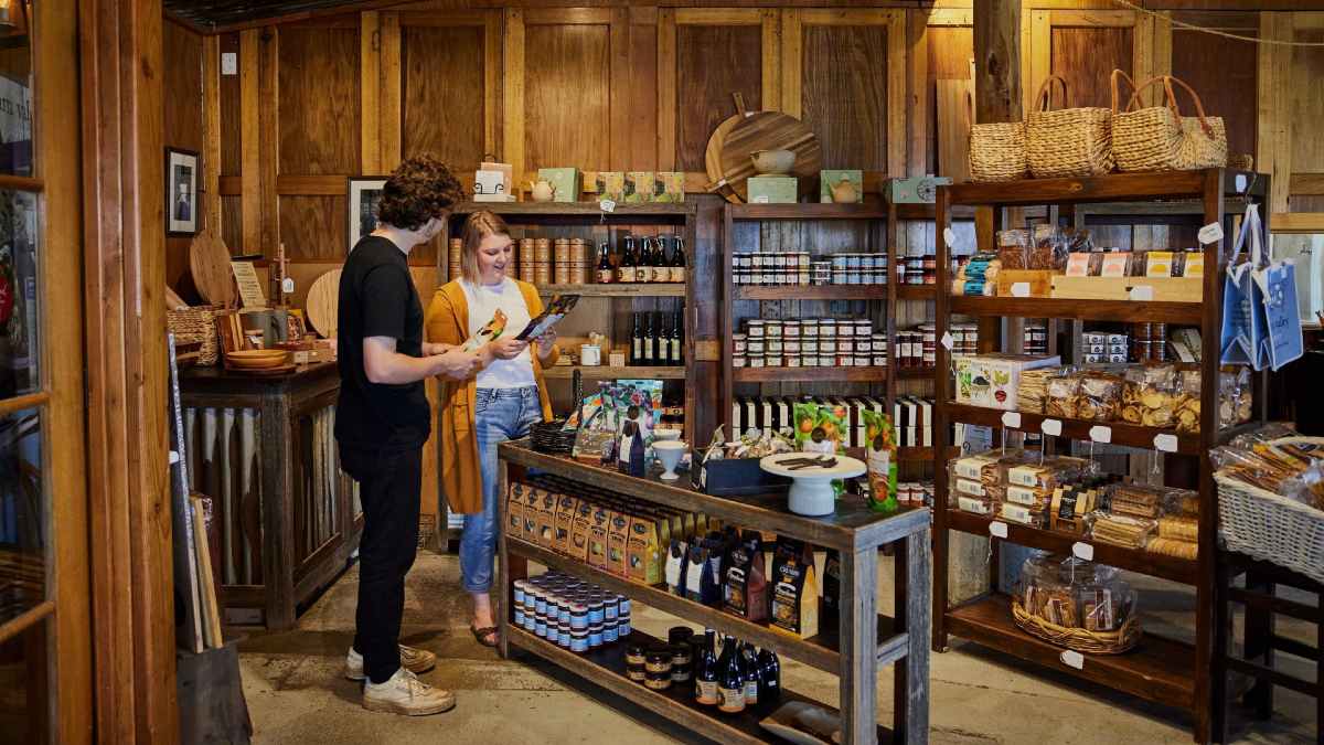 man and woman looking at produce inside a regional dairy