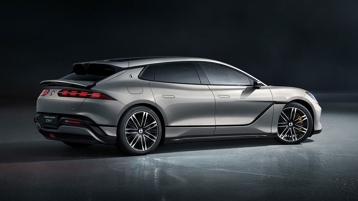 Rear quarter view of light grey Denza Z9 GT sports EV in studio showing long shooting brake body style.