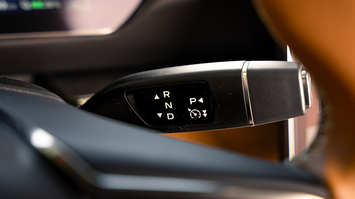 Transmission drive controller attached to steering wheel on Mazda 6e electric car.