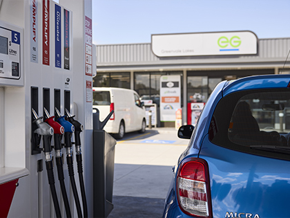 EG Ampol fuel station, featuring a blue Nissan Micra.