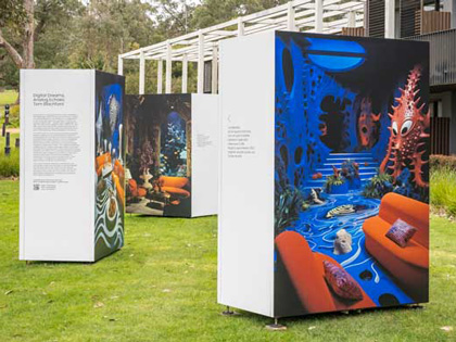 Large block installations displaying various artworks on a grassed area