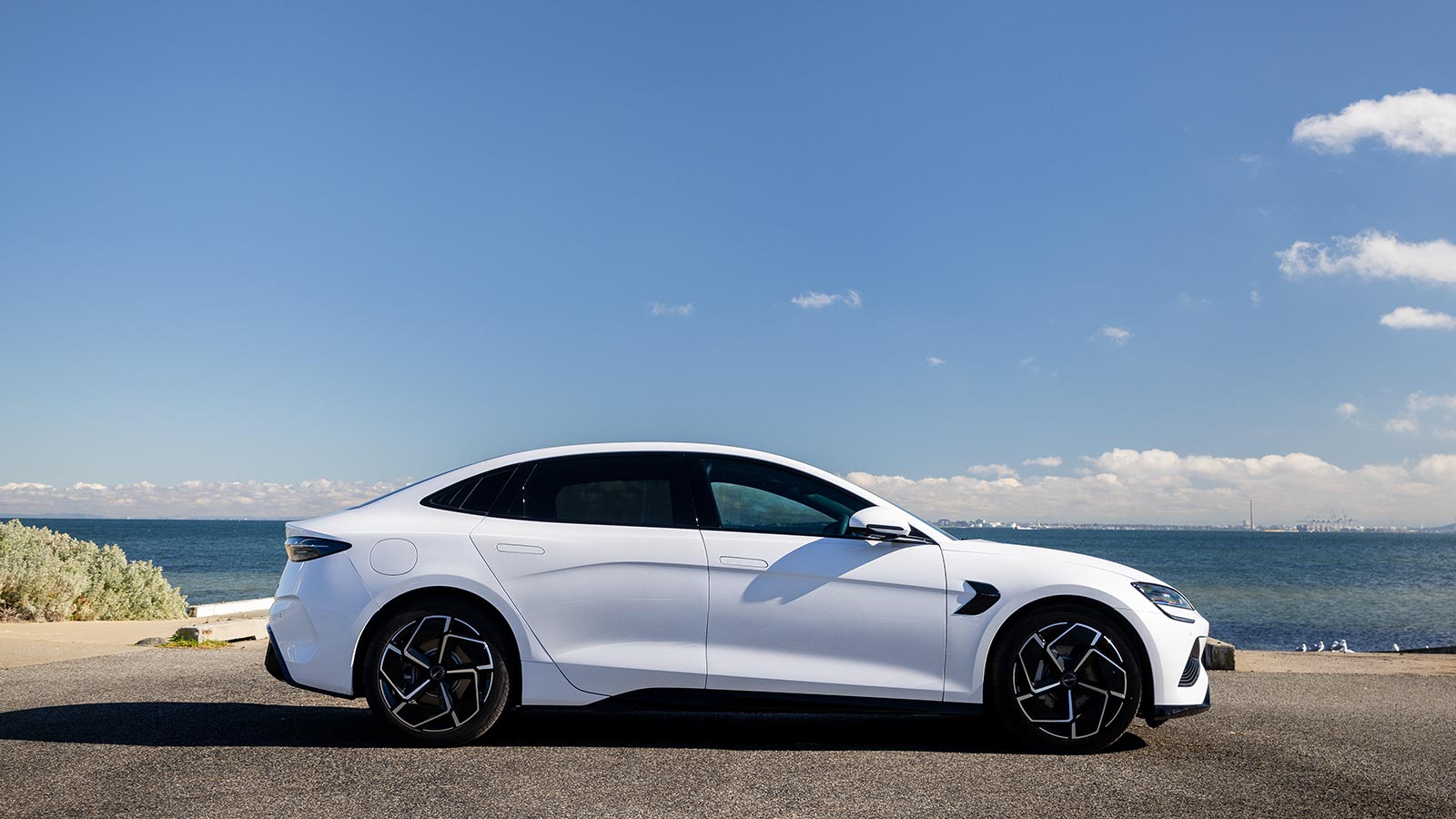 BYD Seal electric vehicle parked on the road next to Brighton waterfront. 