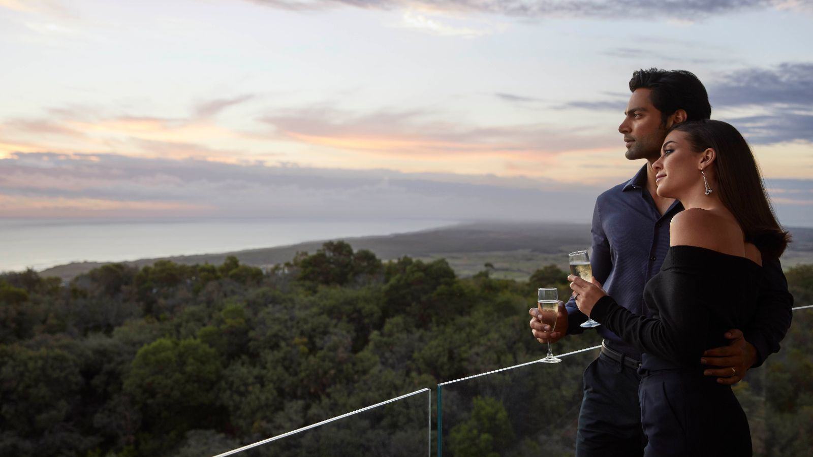 Couple enjoying the view from their room's balcony at Cape Schanck.