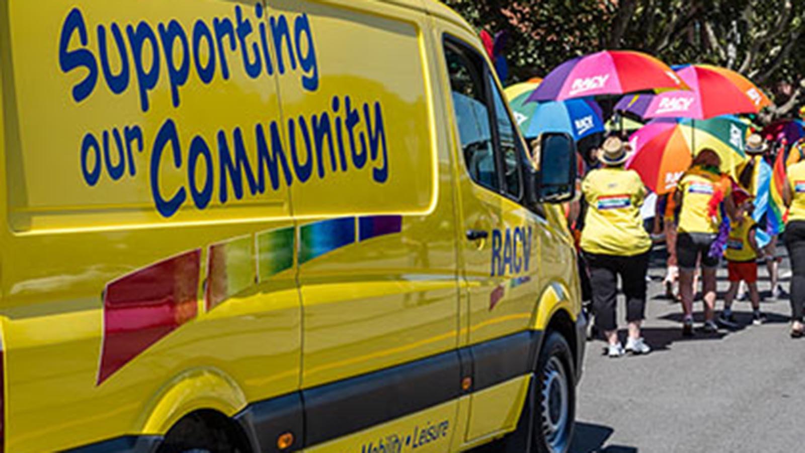 Yellow RACV van and staff members at the Midsumma Pride March.