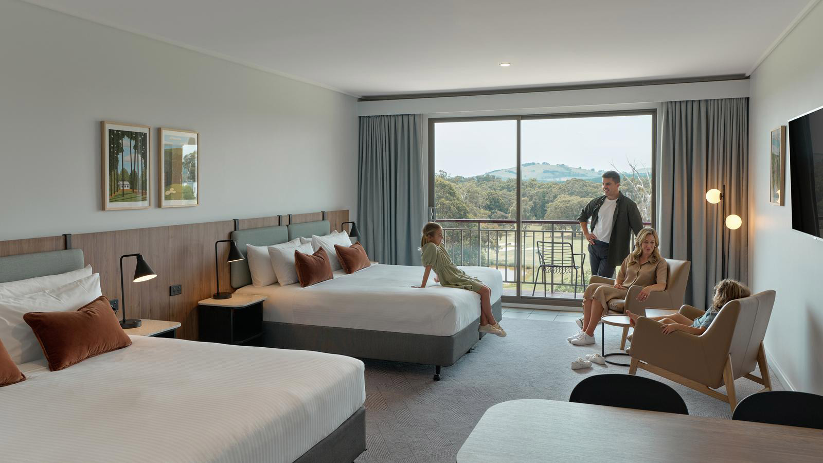 Family relaxing in Fairway Room at RACV Goldfields resort.