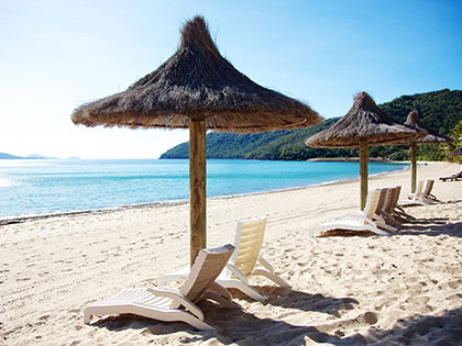 Beach chairs on the sand at Hamilton Island.