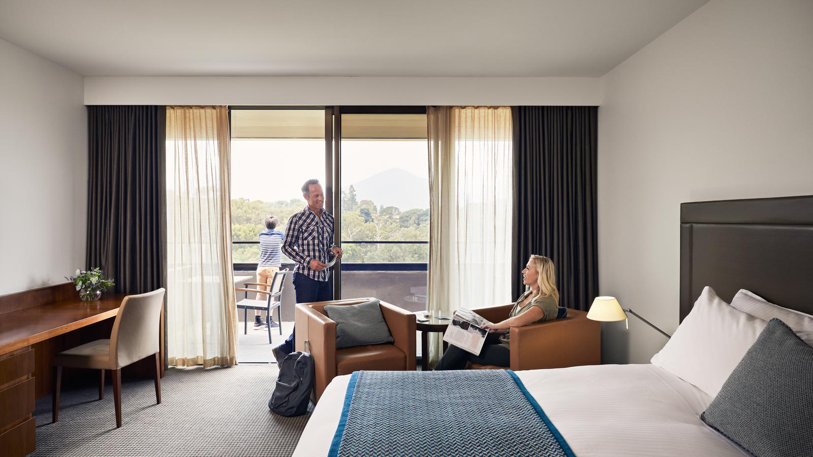 Couple in the Premium mountain views room at RACV Healesville Country Club and Resort.