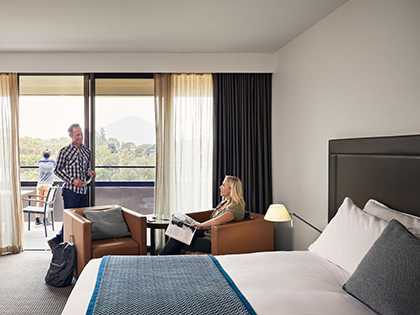 Couple in the Premium mountain views room at RACV Healesville Country Club and Resort.