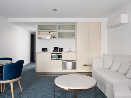 The living area of a king single room at the RACV Hobart Hotel.