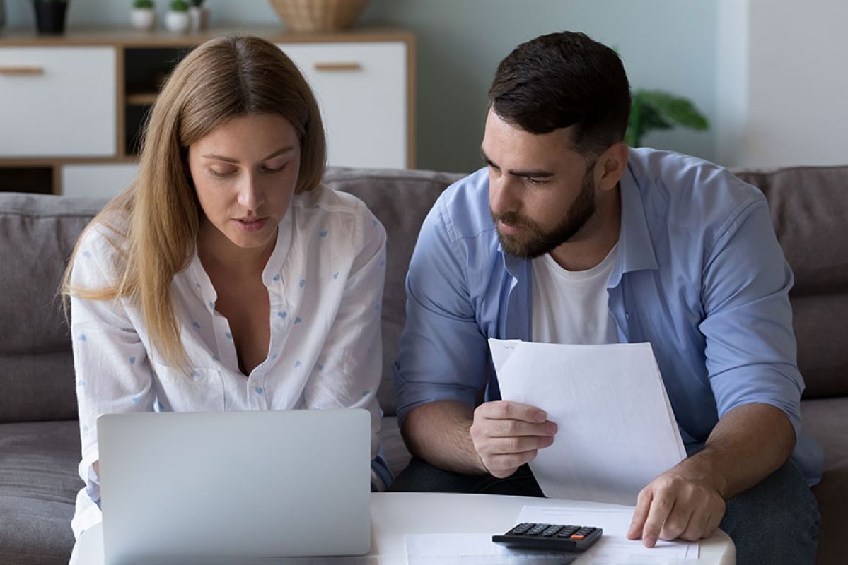 young couple unpacking in new home