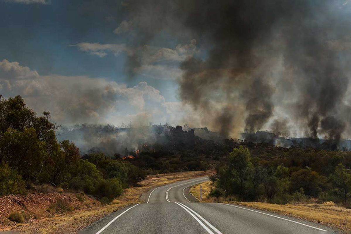 Car with caravan on highway road.