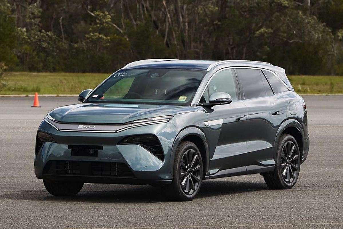 BYD Sealion 8 large SUV in dark aquamarine metallic colour parked on forecourt at bushy Lang Lang proving ground in regional Victoria.