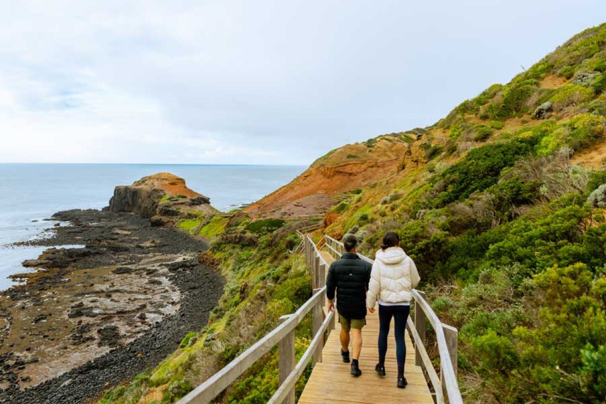 Couple walking on the Cape Schanck Boardwalk