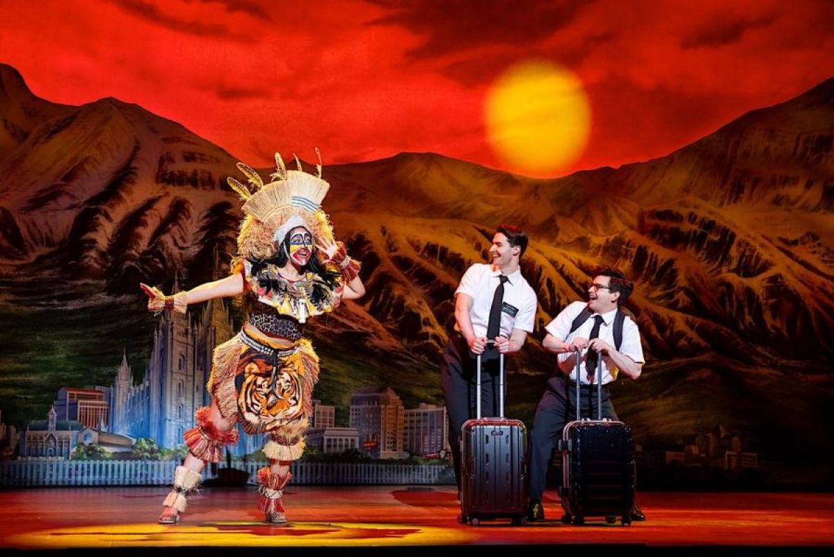 three actors on stage in Sydney's production of The Book of Mormon
