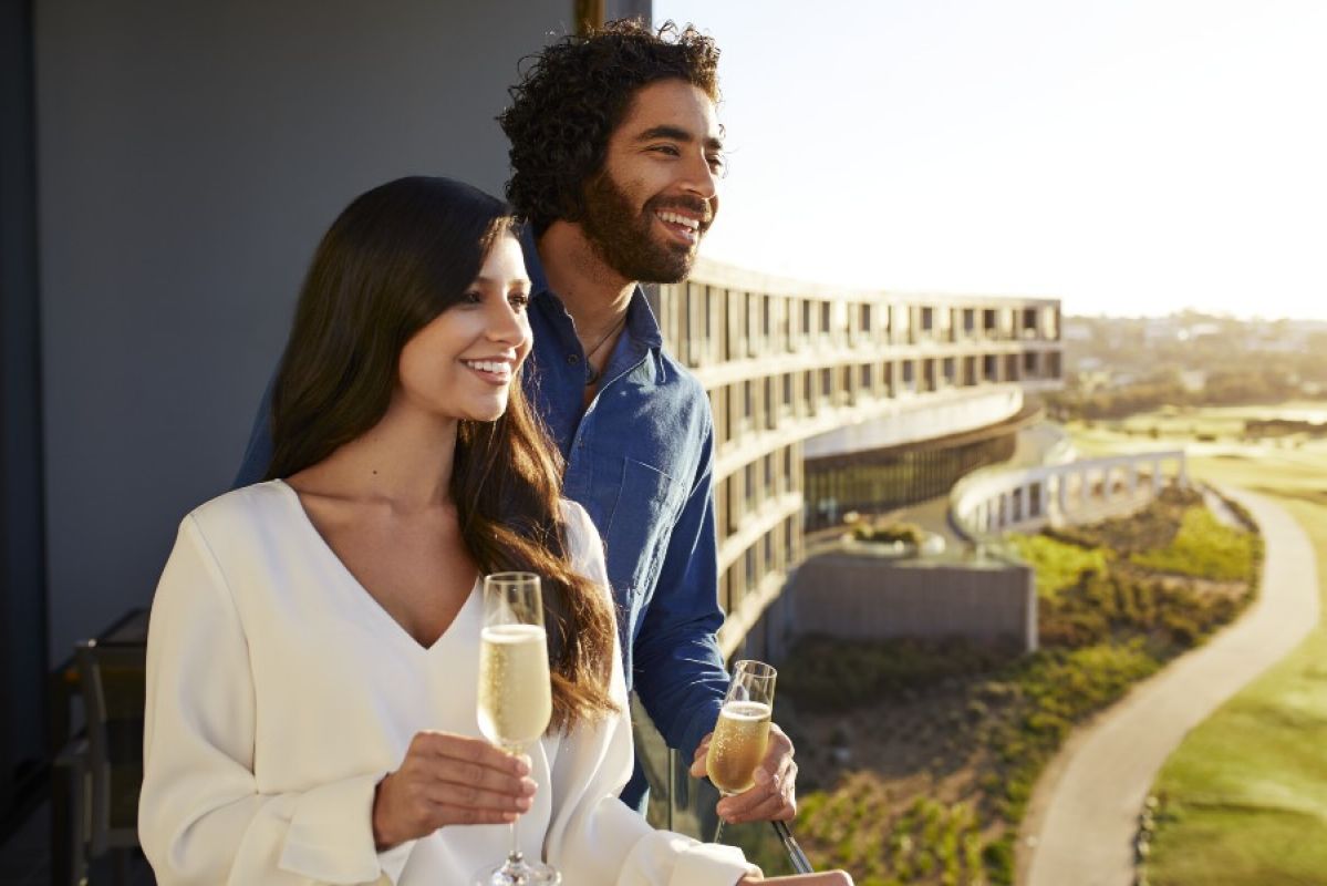 couple drinking champagne on balcony at RACV Torquay Resort