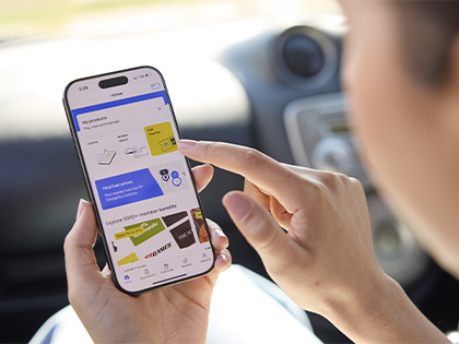 Closeup of a user on their phone, accessing their products via the RACV app.