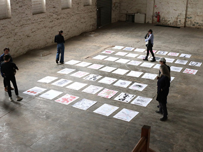Image of people looking at the Negative Press exhibition at RACV Goldfields.