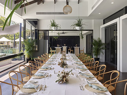 RACV Noosa Resort Acuri Terrace dinner set up with long table.