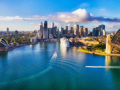 Wide view of Sydney Harbour with a cruise ship.