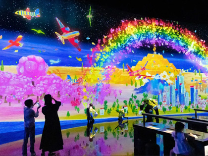 Visitors taking photos while visiting TeamLabs in Japan