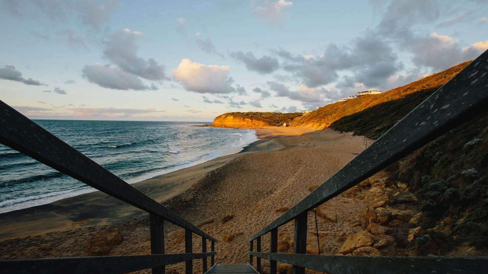 View of Torquay beach atop of the stairs leading to the sand. 