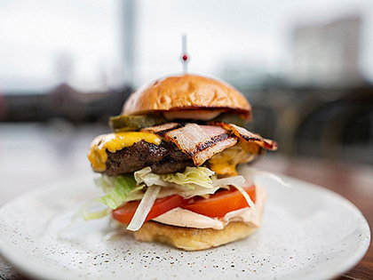 A burger loaded with ingredients. 