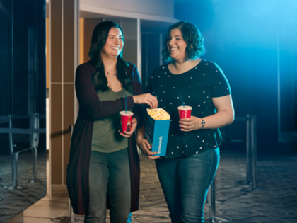 Two women going to watch a movie together